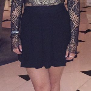 Black pleated mini skirt